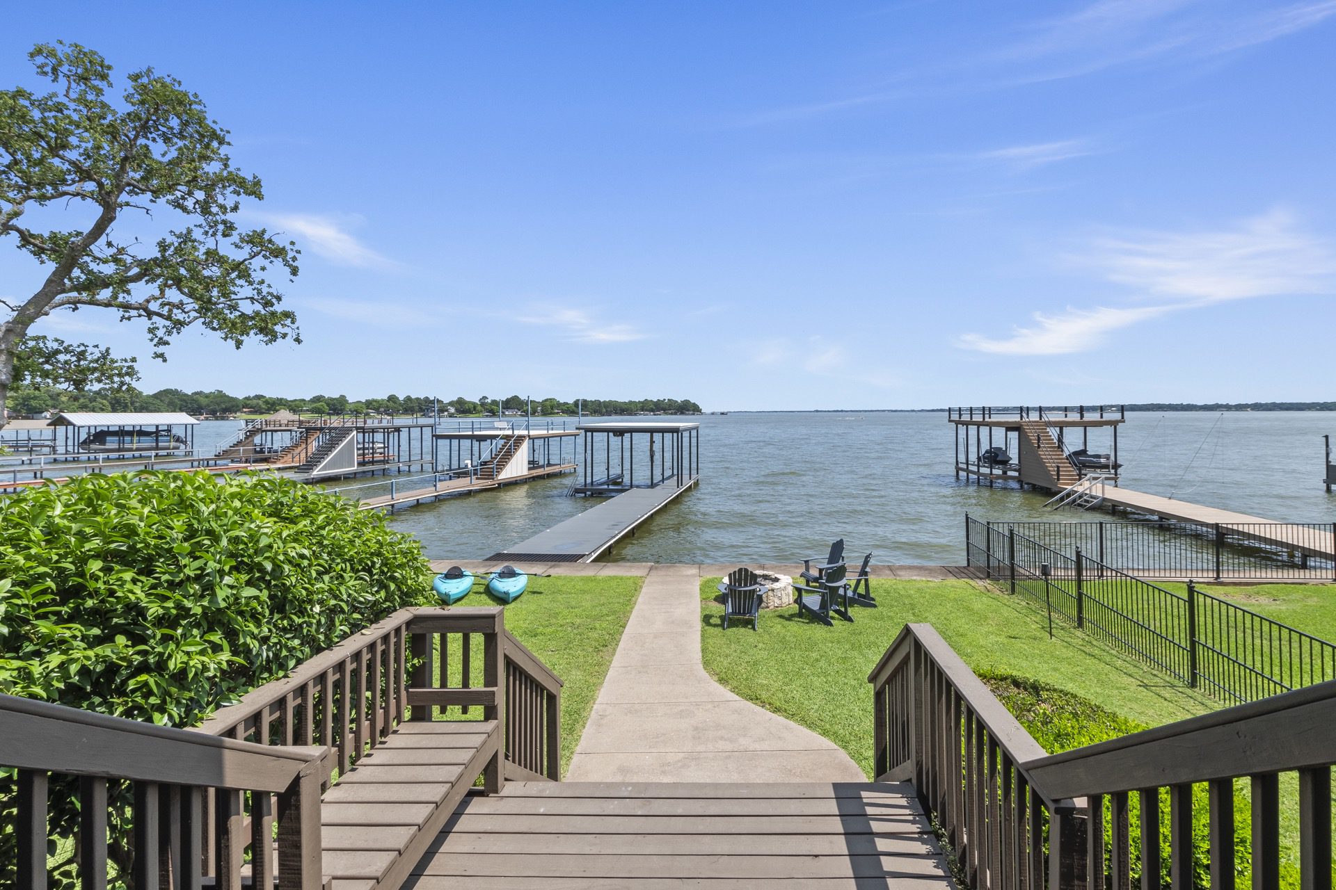 From the back porch, savor uninterrupted views of open water and your private dock—where luxury meets lakeside living.