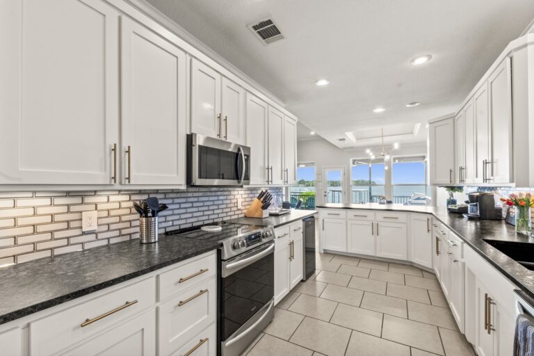 Fully remodeled modern kitchen featuring ample counter space—perfect for preparing meals with ease and style.