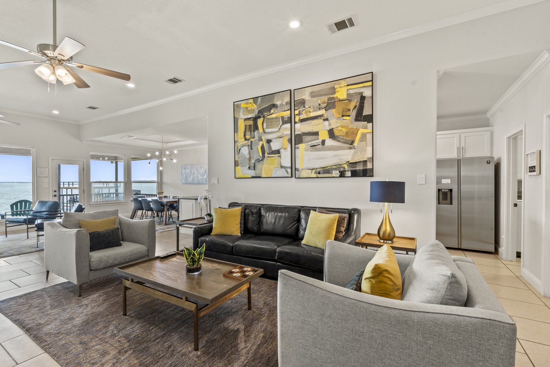 Comfortable living spaces featuring plush seating and floor-to-ceiling windows with uninterrupted open water views.