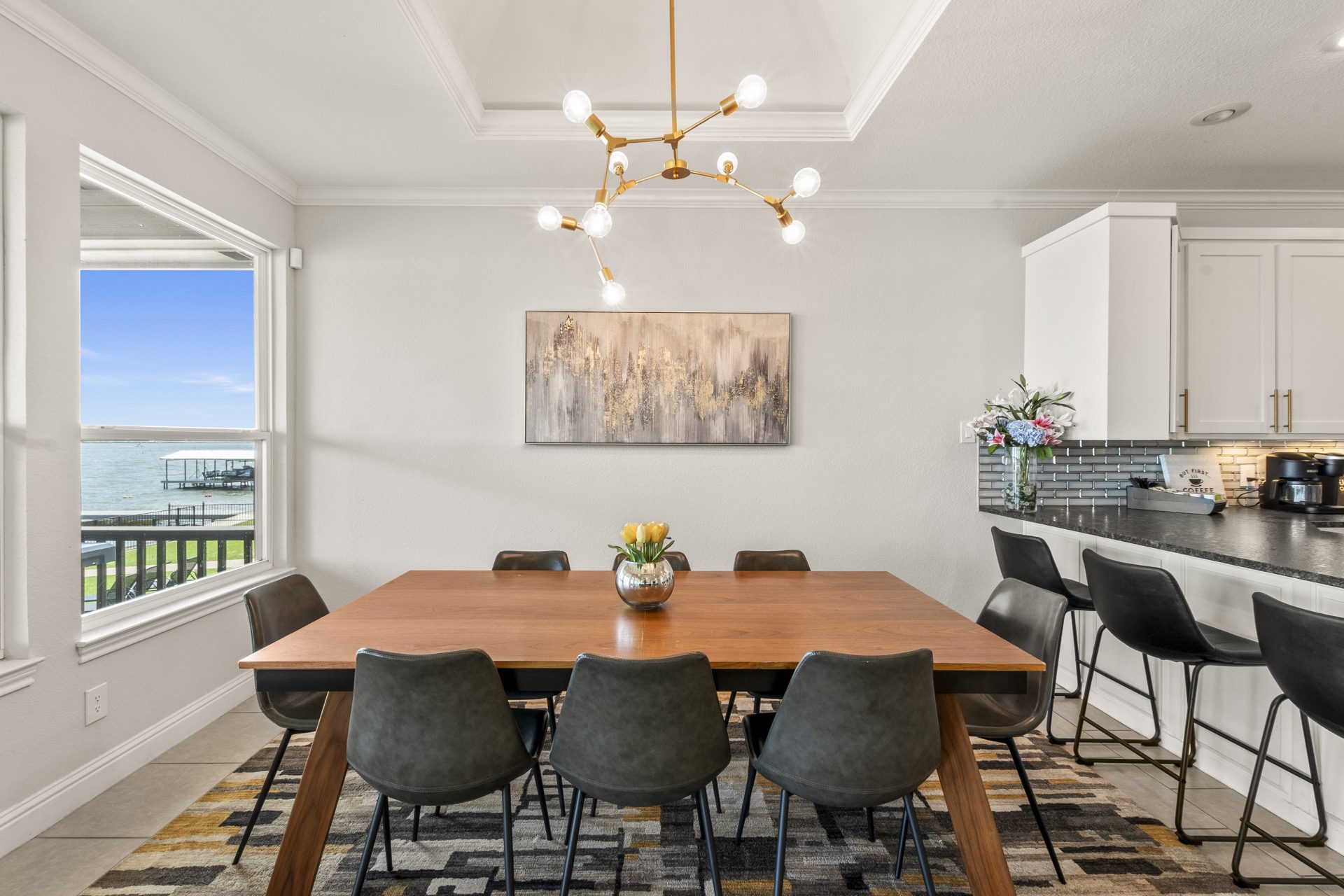 Dining room adjacent to the kitchen, plus counter-height stools for casual meals and conversation.