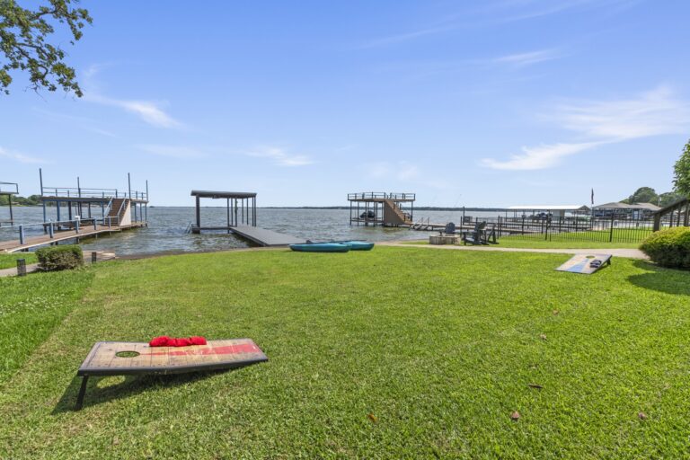 Enjoy some friendly competition with our provided cornhole set—perfect for outdoor fun by the lake!