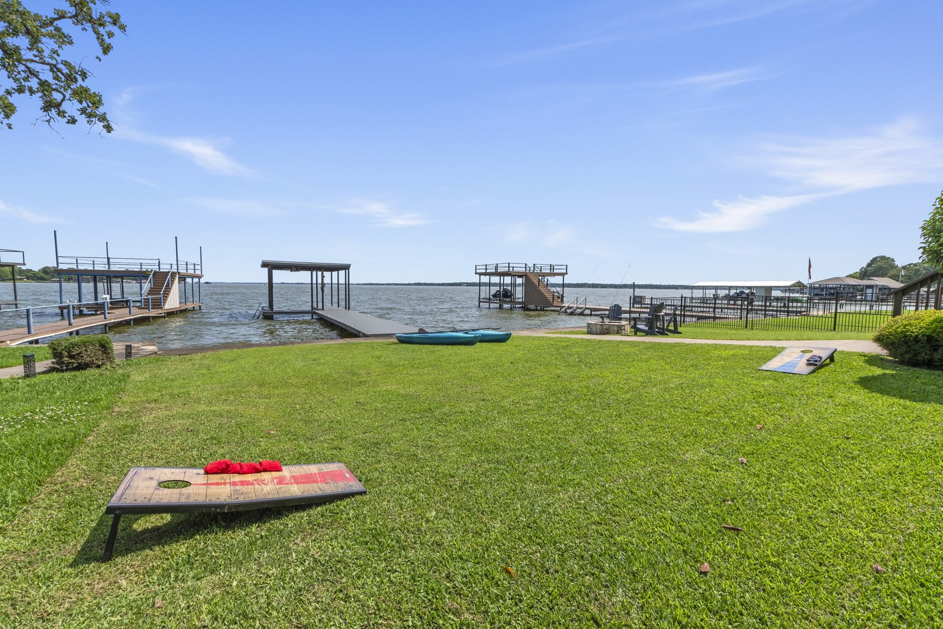 Enjoy some friendly competition with our provided cornhole set—perfect for outdoor fun by the lake!
