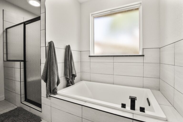 Main bathroom with a separate shower and a relaxing Jacuzzi tub for spa-like comfort.