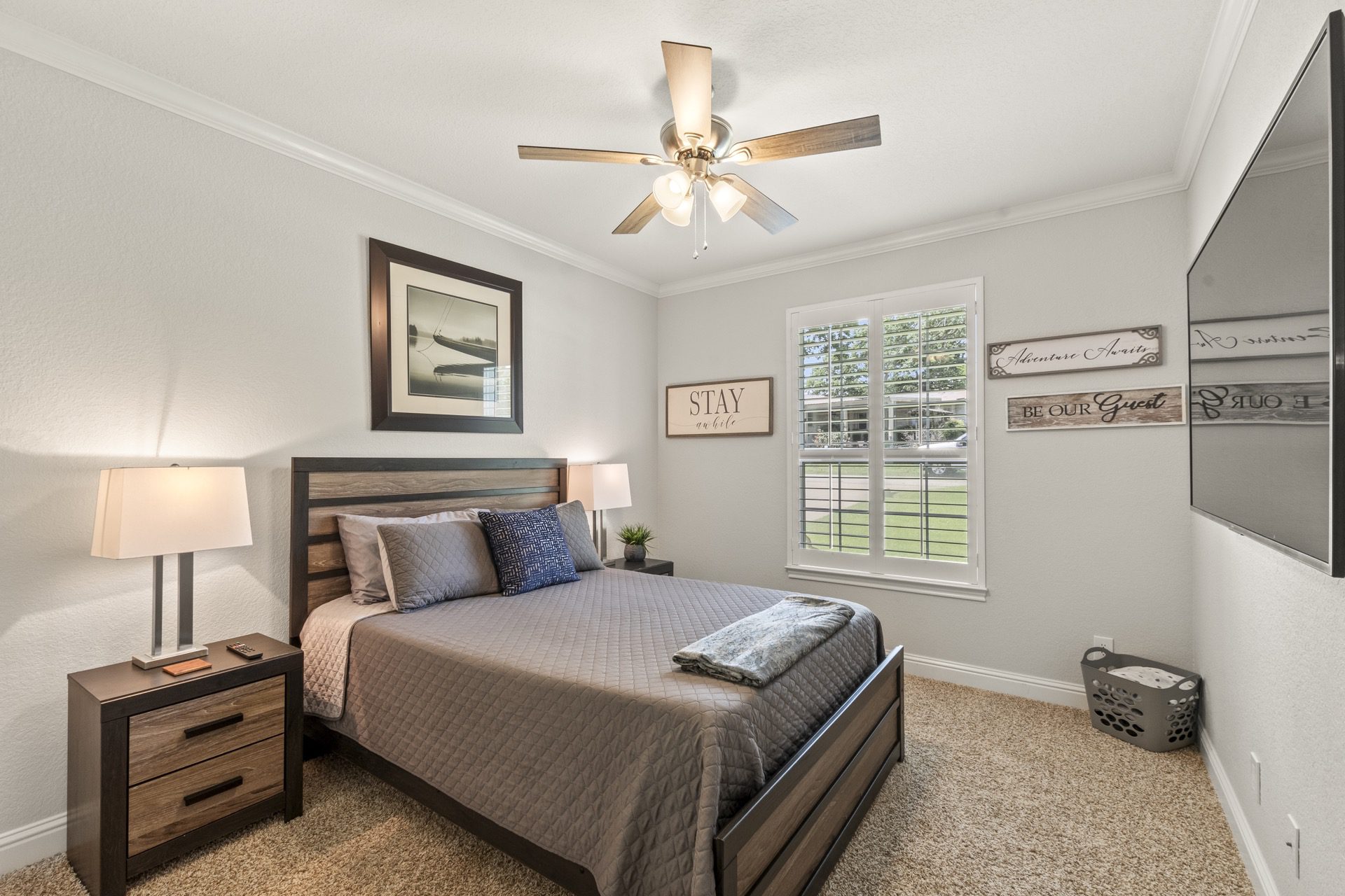 Bedroom #2: Generously sized and elegantly appointed, featuring a plush queen bed and a 65-inch Smart TV for ultimate comfort and entertainment.