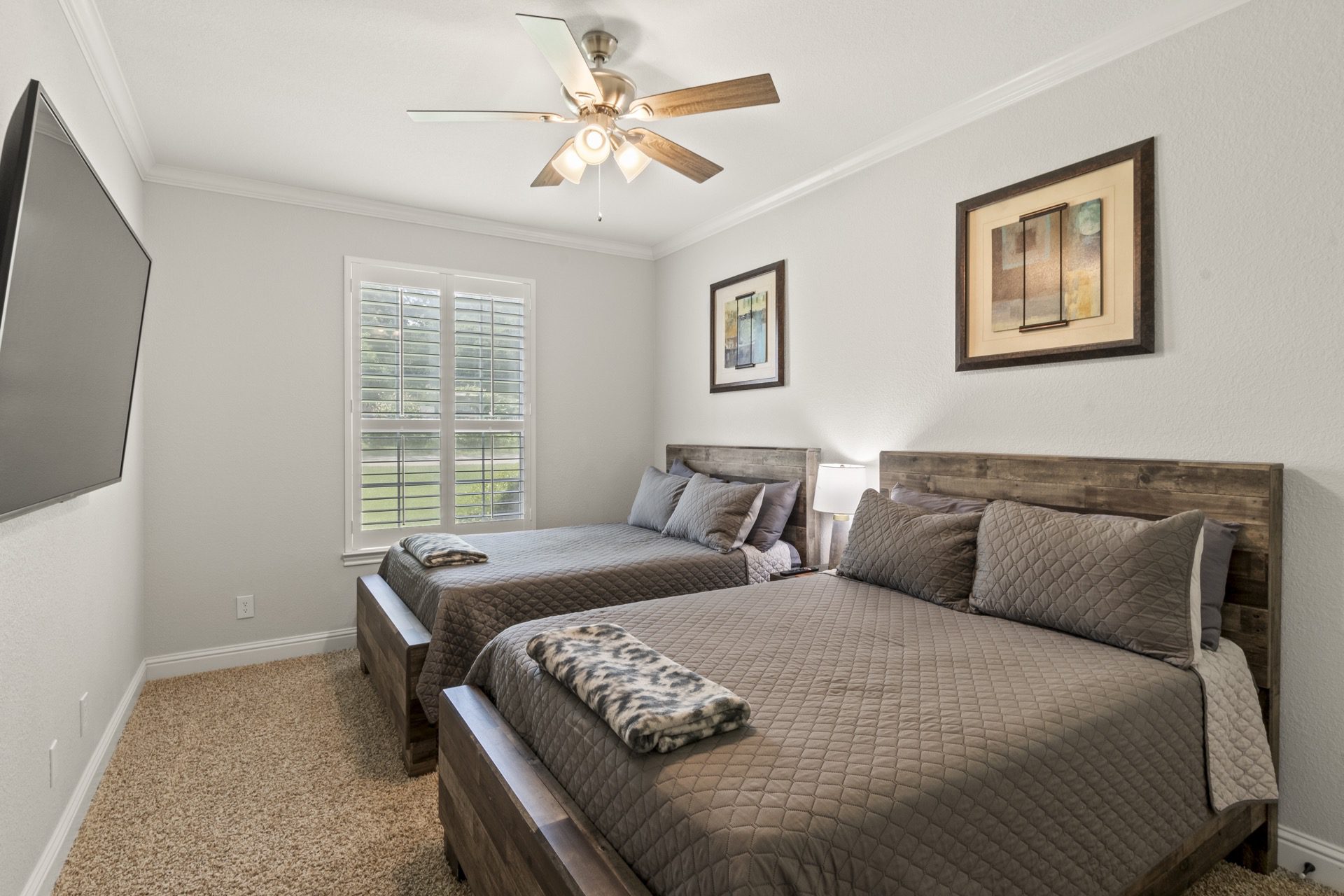 Bedroom #3: Thoughtfully designed for comfort and versatility, featuring two full-size beds and a 65-inch Smart TV—perfect for families or groups seeking refined relaxation.