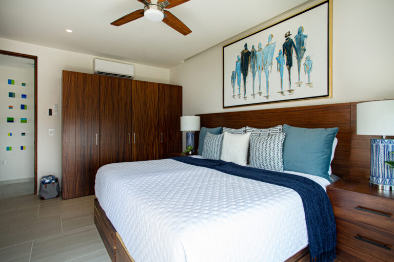 Wake up to ocean views from bed, then step outside onto the balcony to take it all in from the swivel chair — the spacious guest bedroom features generous closet and storage space and a 55" TV, making it a true home away from home.